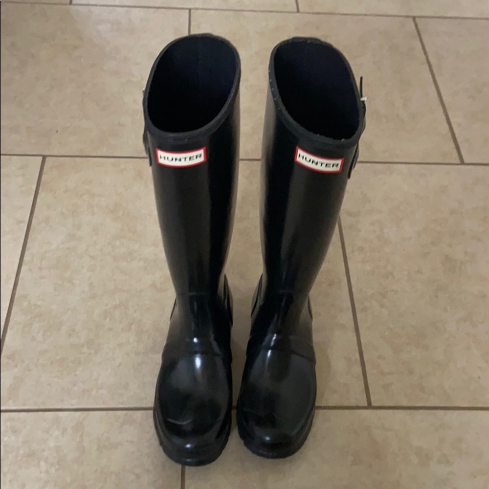 Tall black glossy hunter rain boots